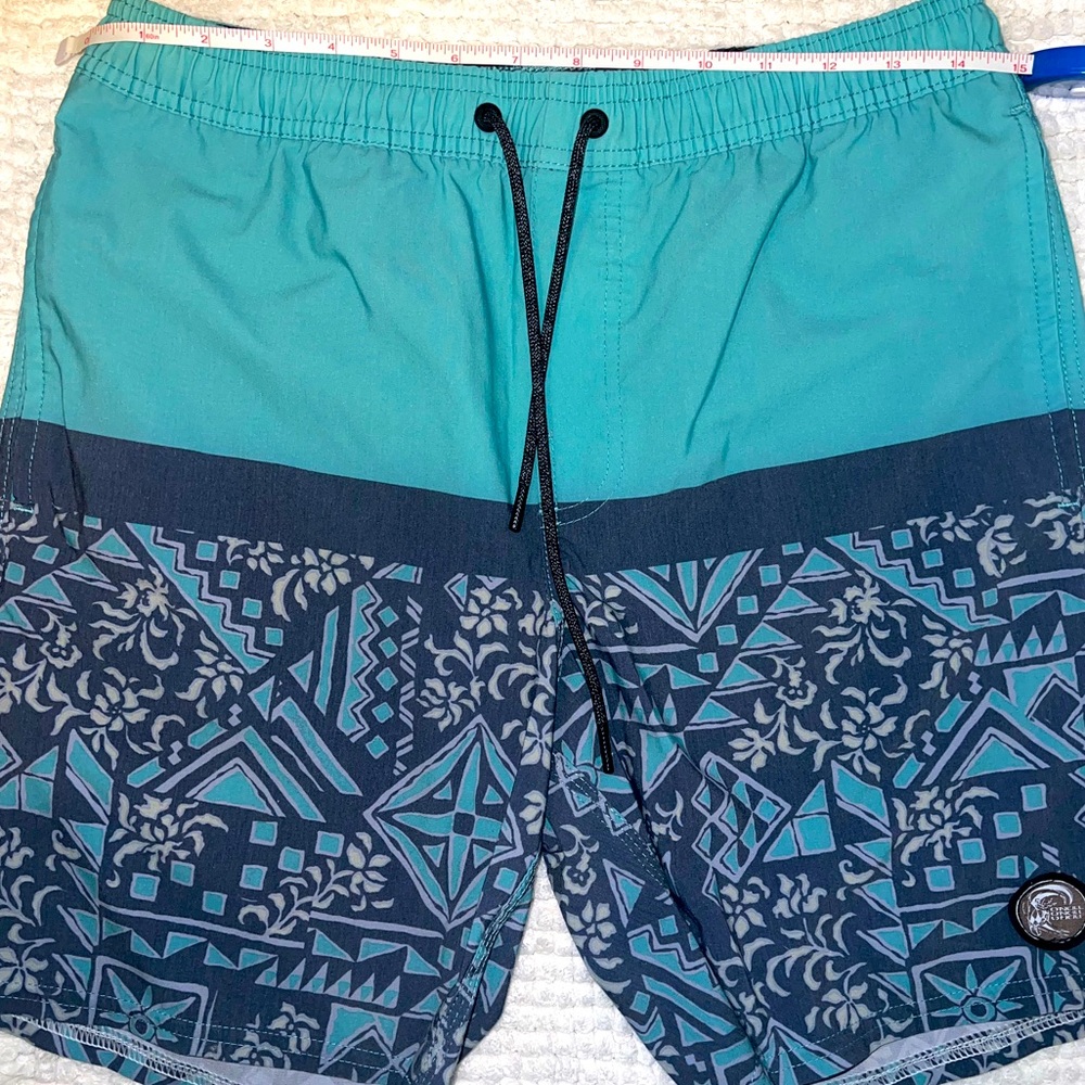 EUC O’Neill men’s swim shorts. Multi pockets. Teal color with design. Small